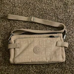Kipling Quaso small cross body clutch Peppery taupe tan color